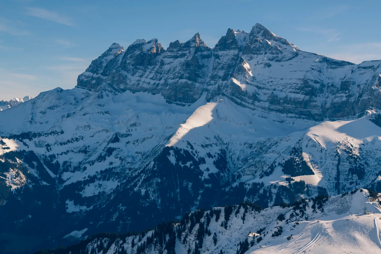 Beautiful snowcapped mountains with blue sky at the ski resort of Morzine in the Alps Mountain Range
