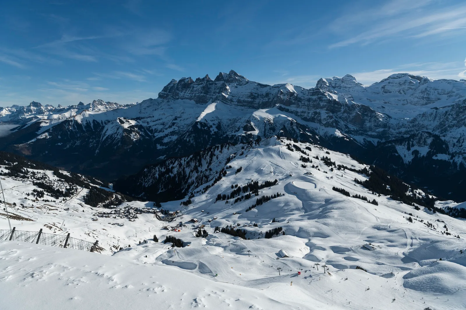 Beautiful snowcapped mountains and ski slopes with blue sky at the ski resort of Morzine in the Alps